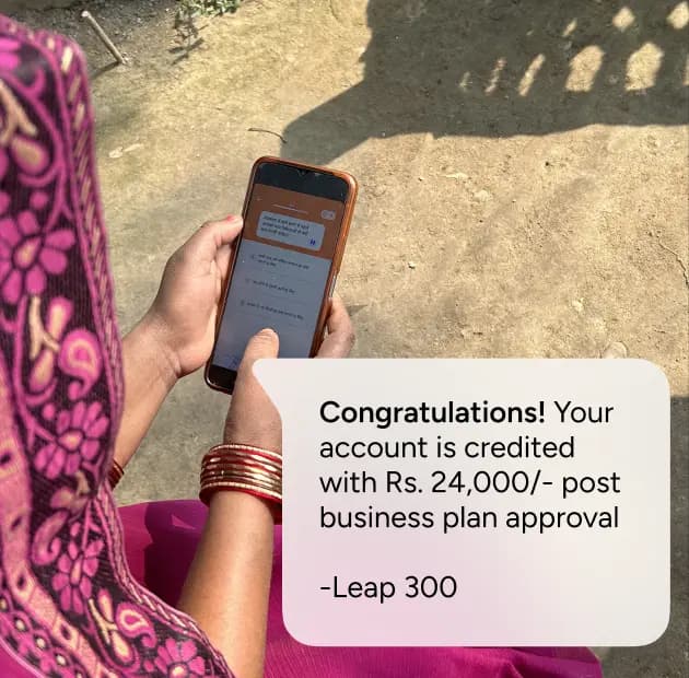 Beneficiary receiving grant notification on phone